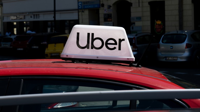 an Uber sign on car