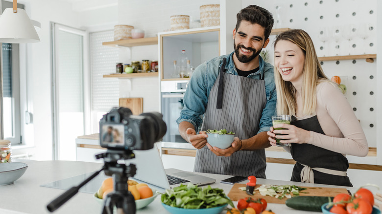 couple filming for cooking gig