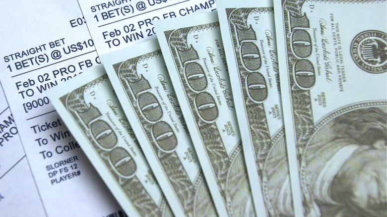 $100 bills and betting receipts