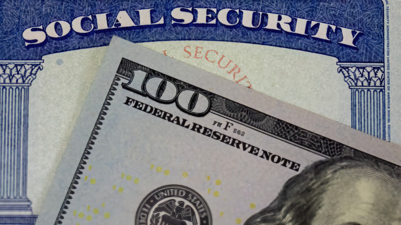 Social Secufrity card and $100 bill