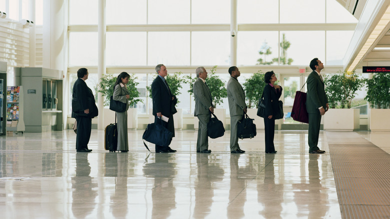 people lining up in airport