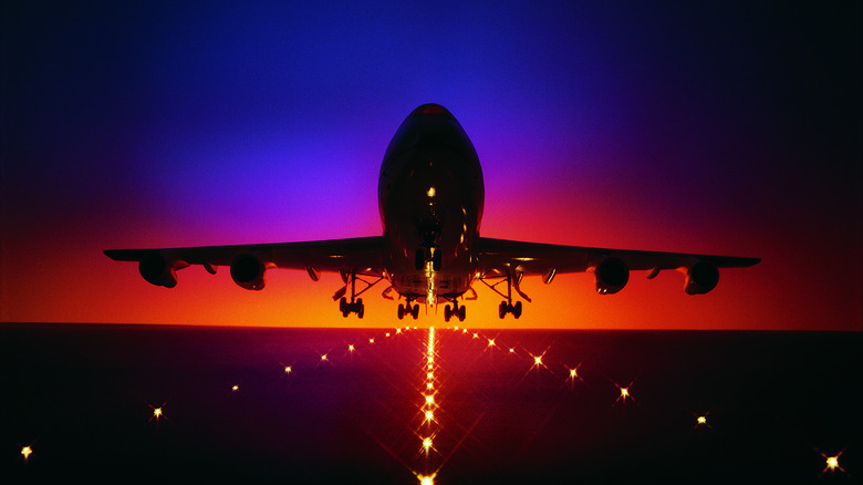 airplane taking off at night