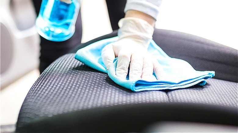 Person applying fabric protection