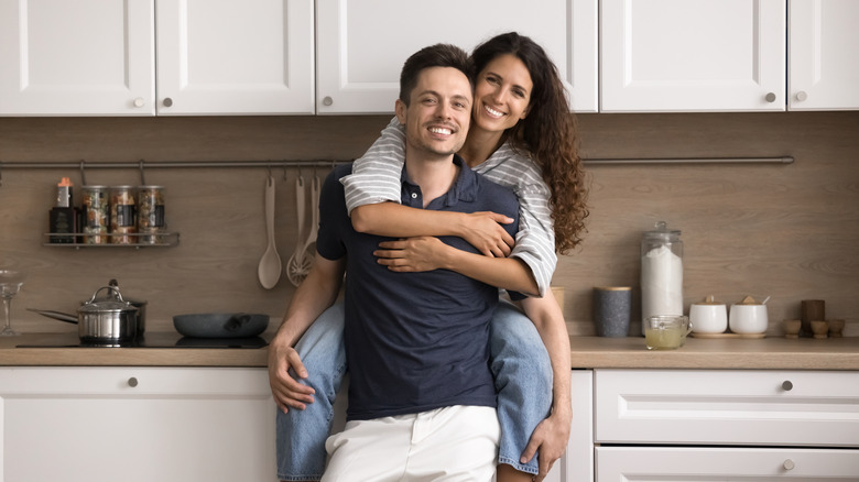 a couple in their kitchen