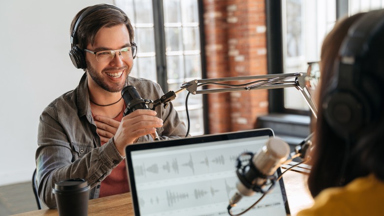 Two people podcasting