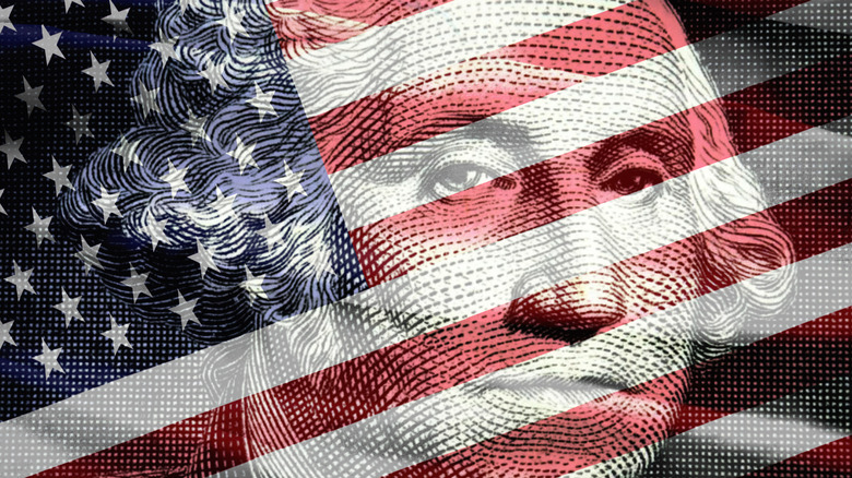 $100 bill Washington face and U.S. flag
