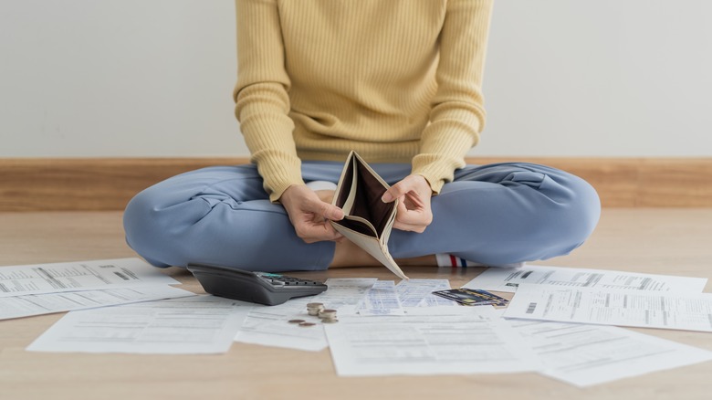 Empty wallet and bills