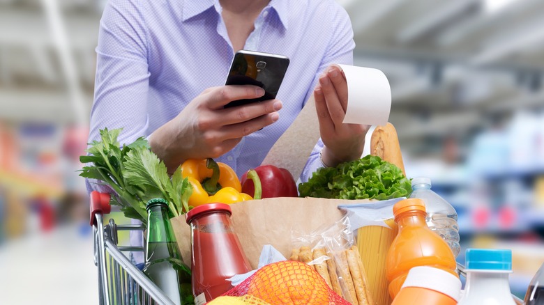shopper checking grocery list