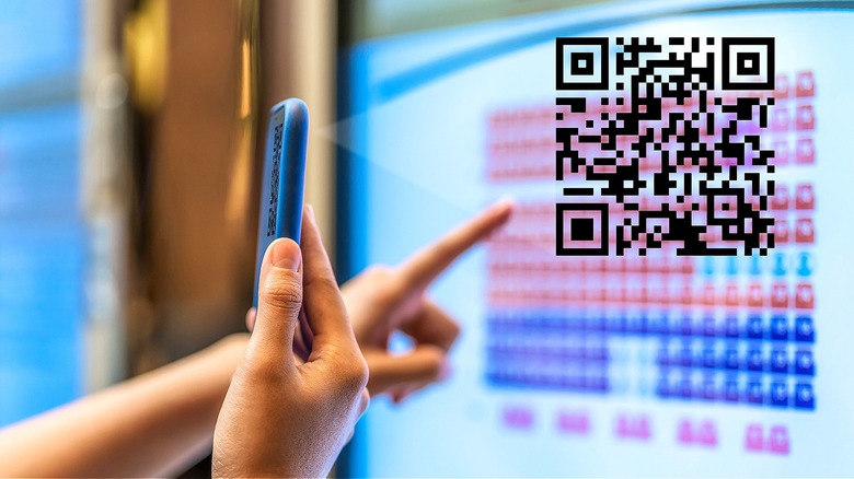Person scanning a QR code