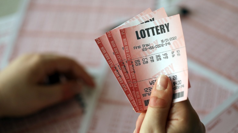 holding lottery tickets