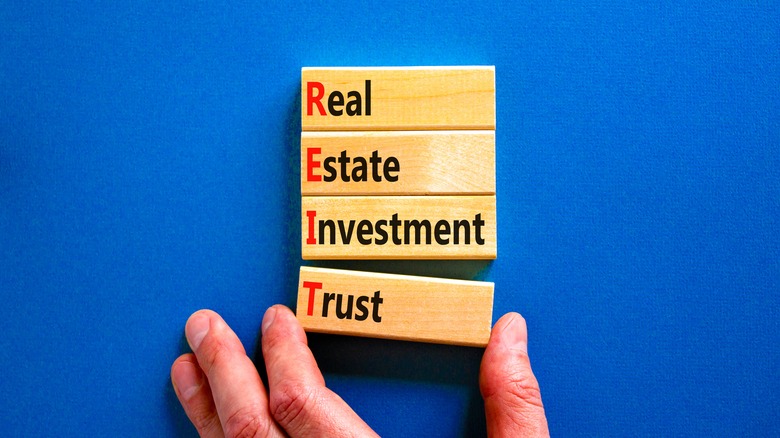 REIT spelled in blocks