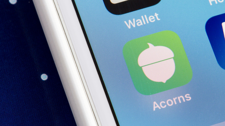 Acorns app logo on phone