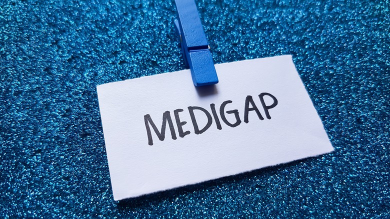 Medigap writting on blue background.