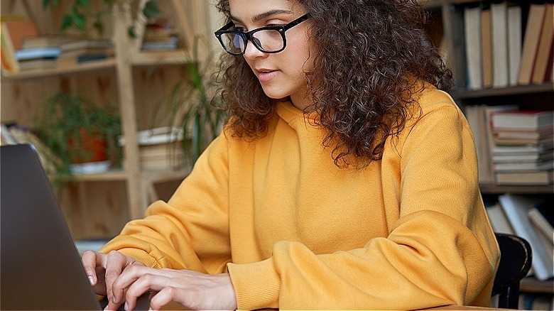 Person typing on a laptop