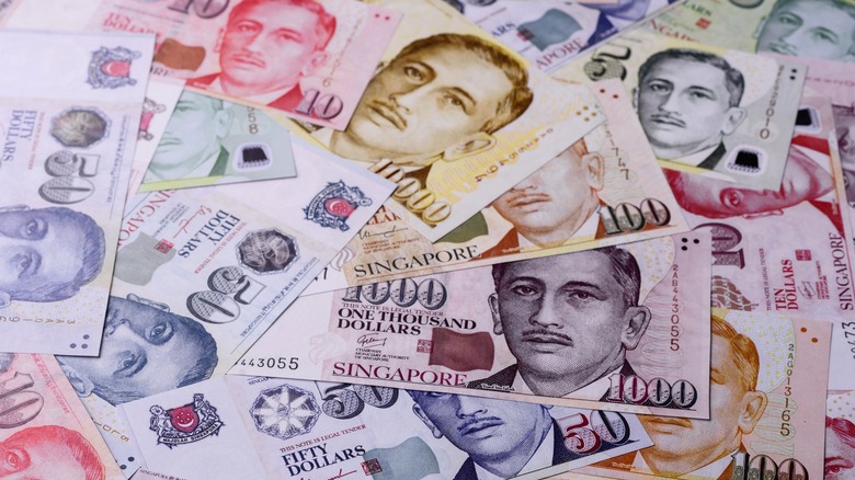 A pile of Singapore Dollar banknotes.