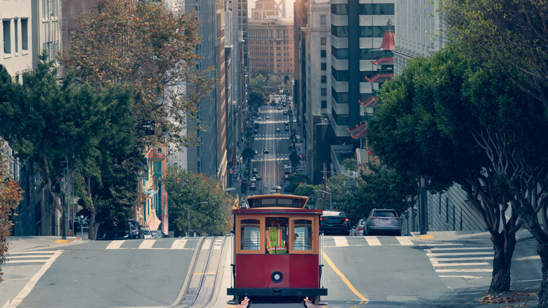 A cable car passing through a San Francisco street