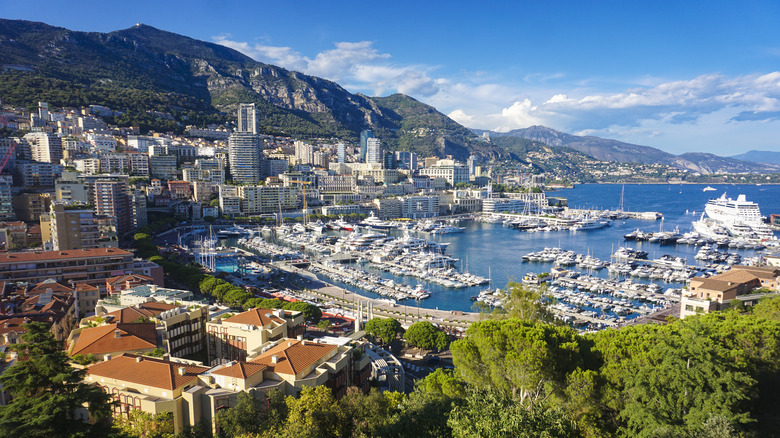 An aerial view of the infamous Monaco Port filled with expensive yachts.