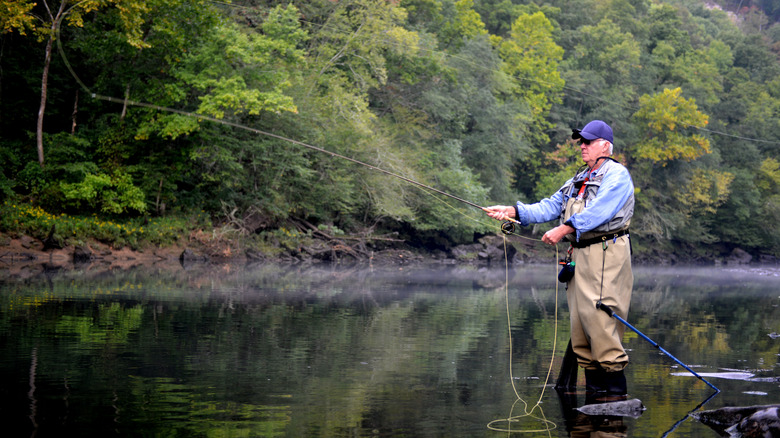 An elderly man fishing