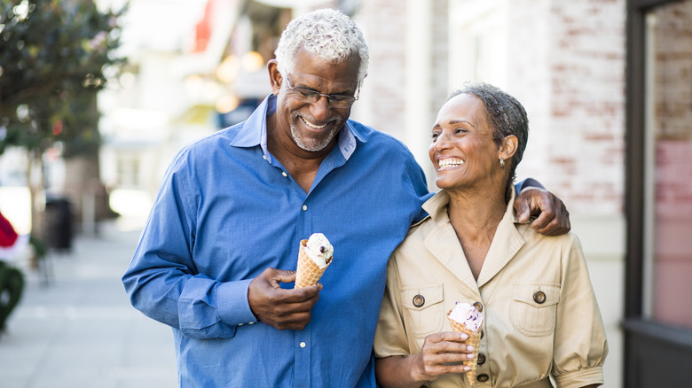 A retiree couple smiling