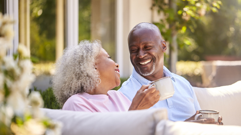 An elderly couple sitting