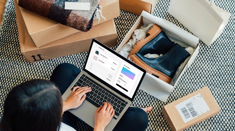 Person shopping online, opening purchases