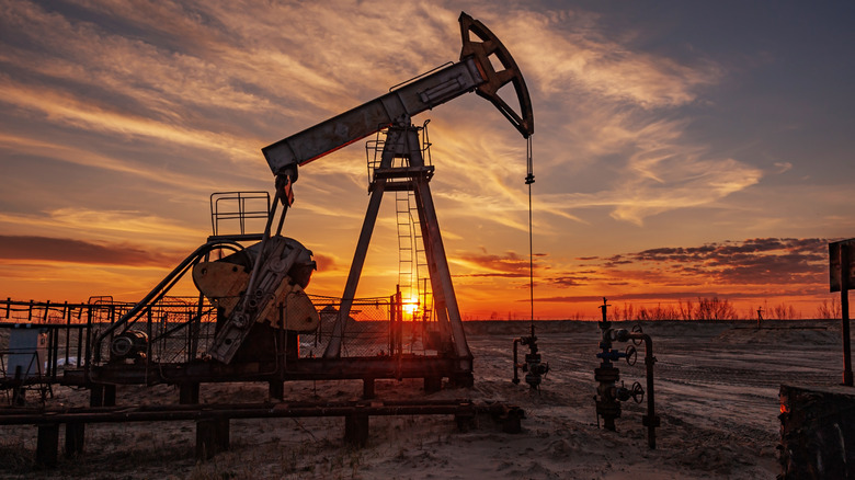 an oil pump at sunset