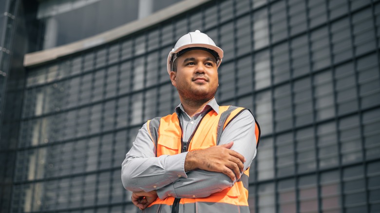 man in hard hat and orange vest