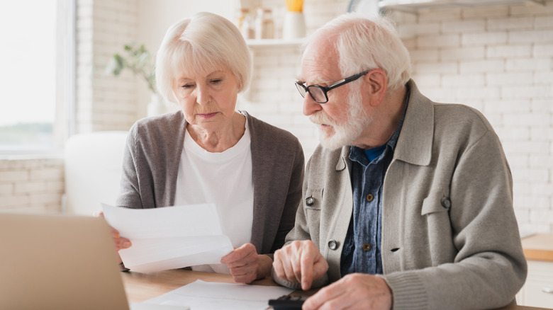 seniors looking at a credit card statement