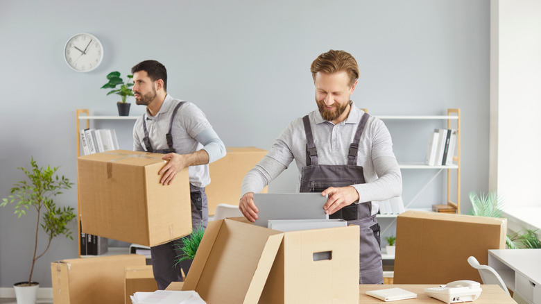 movers grabbing boxes