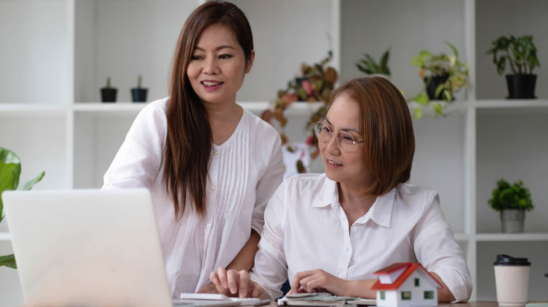 older women tracking their retirement balances online