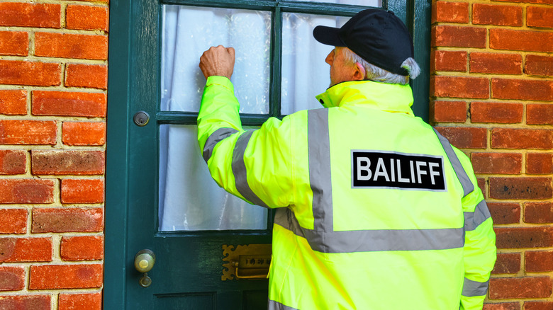 Bailiff arriving for debt collection