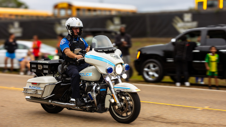 Flowood Police Department motorcycle officer riding down the street.