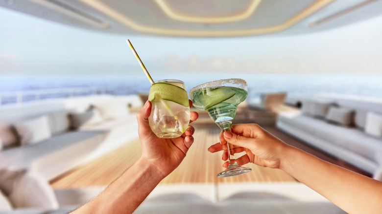 People toasting drinks on a yacht