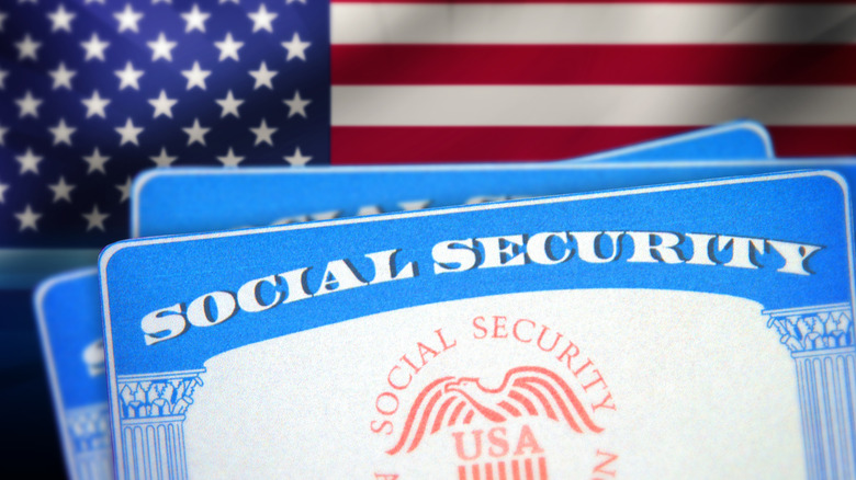 social security cards in front of american flag