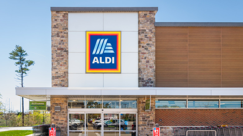 A standalone Aldi store location on a sunny day