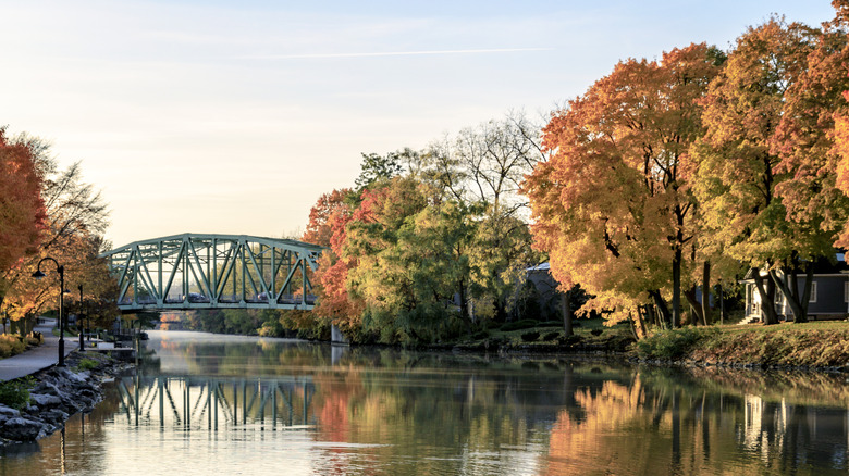 Trees changing autumn colors on the Erie canal Waterway in Pittsford