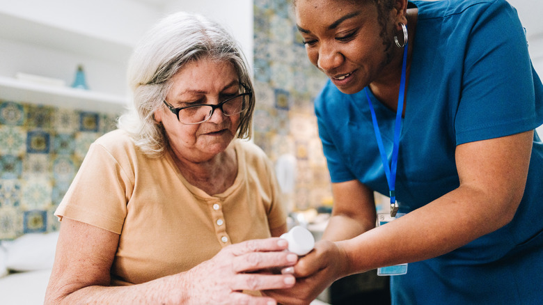 An elderly patient and nurse