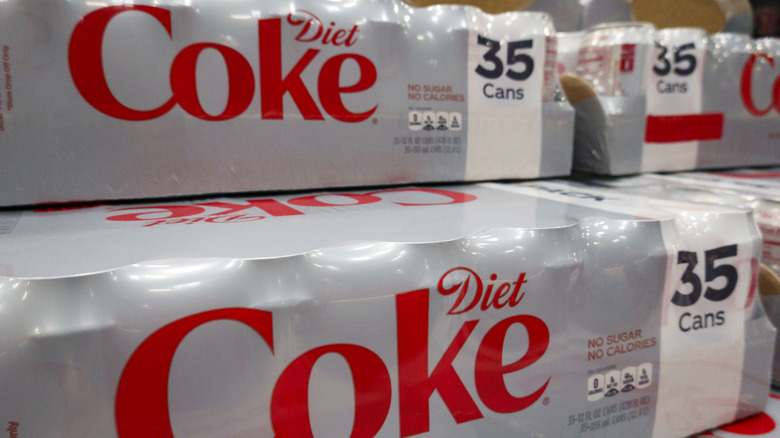 a stack of 35-can plastic cases of Diet Coke