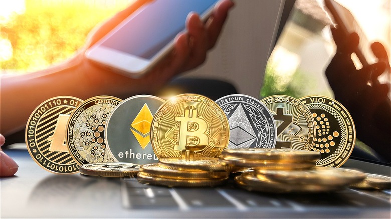 Cryptocurrencies and person using smartphone