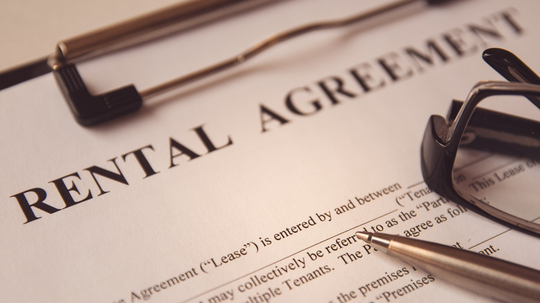 Rental agreement document on a clipboard
