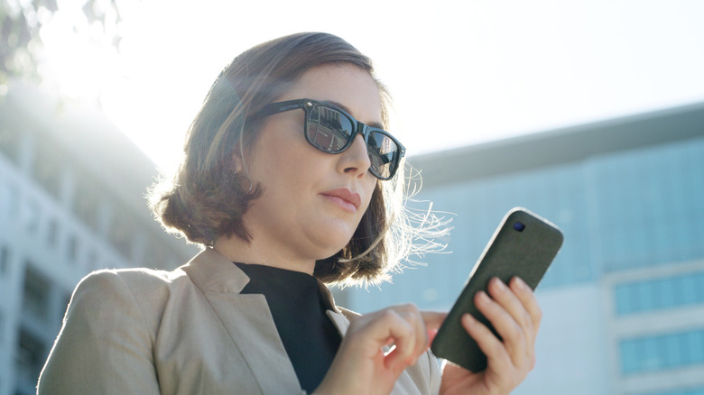 Shot of a young businesswoman using a smartphone