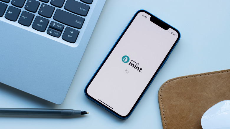 Mint mobile app is seen opened on an iPhone.