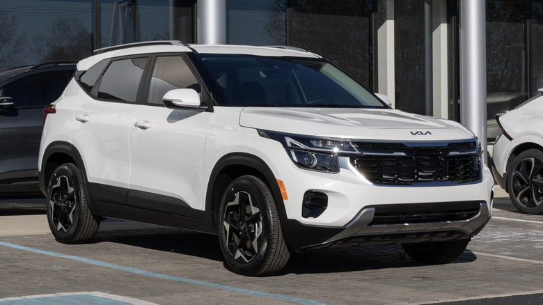 Kia Seltos S AWD Compact SUV display at a dealership.