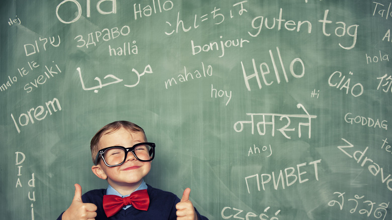 kid and languages on blackboard