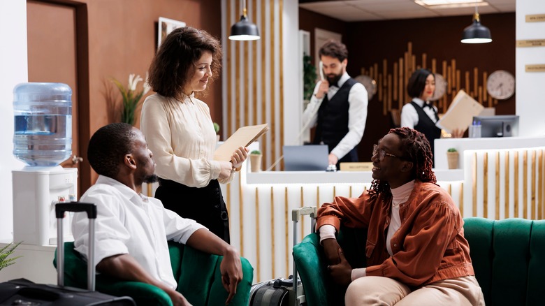 a manager speaking with guests