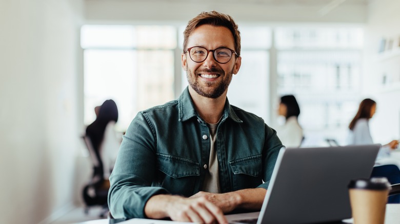 A man smiling at work