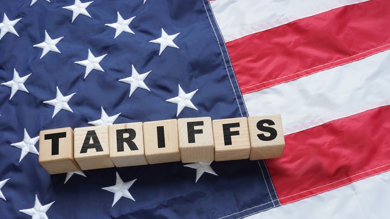 Import Trade Tariffs increase concept with United States of America Flag