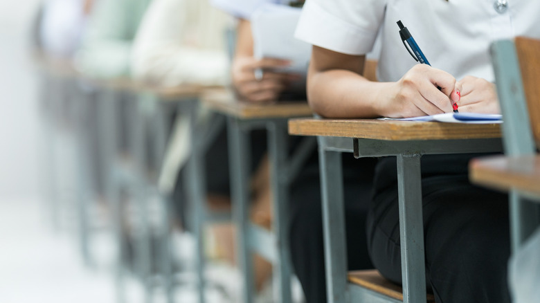 row of students taking a test