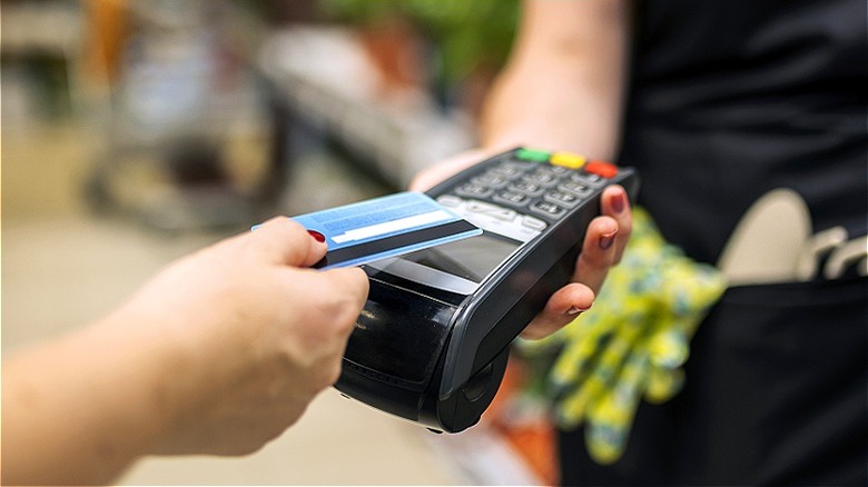 Person paying with credit card
