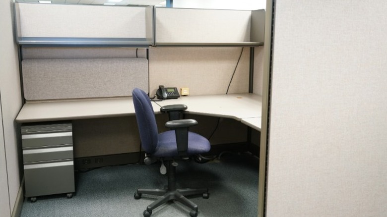 An empty cubicle for an employee who is no longer able to work.